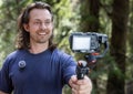 Young man filming with a camera gimbal Royalty Free Stock Photo