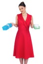 Content glamorous model in red dress offering presents Royalty Free Stock Photo