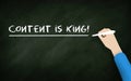 Content Is king Chalkboard. Human hand writing