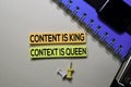 Content is King. Context Is Queen text on sticky notes isolated on office desk Royalty Free Stock Photo