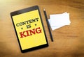 Content is king on mobile device screen with pen and business ca Royalty Free Stock Photo