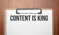 Content is King text on white paper on the wood table Royalty Free Stock Photo