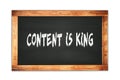 CONTENT  IS  KING text written on wooden frame school blackboard Royalty Free Stock Photo