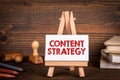 Content Strategy concept. Miniature easel on office desk Royalty Free Stock Photo