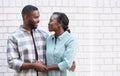 Affectionate African couple smiling at each other in the city Royalty Free Stock Photo