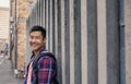 Content young man leaning against a wall in the city Royalty Free Stock Photo