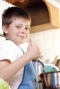 Contented boy at kitchen