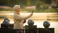 Contented middle-aged lady making video call looking at smartphone screen talking on cell phone. Elderly woman in Royalty Free Stock Photo