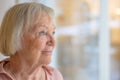 Contented senior woman smiling to herself