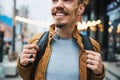 Contented smile of happy male young tourist