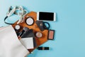 Contents of woman`s bag.Top view of Women bag and lady stuff with copyspace on pink background Royalty Free Stock Photo