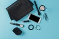 Contents of woman`s bag.Top view of Women bag and lady stuff with copyspace on pink background Royalty Free Stock Photo