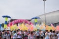 Contestants throw colored chalk at color run