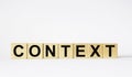 CONTEXT Word written on wooden cubes