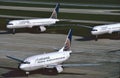 3 Continental Airlines Boeing aircraft waiting on the ramp for a gate .