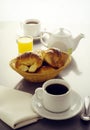 continental breakfast of cup of coffee with croissants orange juice and tea cup white background Royalty Free Stock Photo