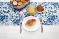 Continental breakfast with fresh croissants, biscuits, bread, jam and orange juice on table Royalty Free Stock Photo