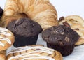 Continental breakfast table setting with pastries and cakes