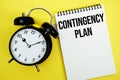 Contingency Plan text with alarm clock flat lay on yellow background Royalty Free Stock Photo