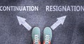 Continuation and resignation as different choices in life - pictured as words Continuation, resignation on a road to symbolize