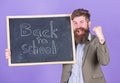 Continue your education with us. New semester in school. Teacher invites to continue studying. Teacher bearded man