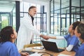 Continuing the successful practice of comprehensive care. doctors shaking hands during a meeting in a hospital.