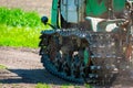 Continuous caterpillar tracks of the bulldozer. Close up detail of a metall crawler tractor tracks Royalty Free Stock Photo