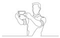 Continuous line drawing of standing man making selfie with his mobile phone