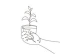 Continuous one line drawing agronomist holding seedlings in peat pots. Female hands touching the plants for planting tree. The