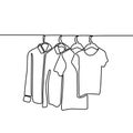 Continuous one line drawing of sweater, shirt, and t-shirt hanging on clothing rack. Minimalistic style of fashionable wardrobe