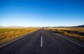 Continuous Road In A Scenic With Mountain Ranges Afar Royalty Free Stock Photo