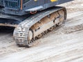 Continuous tracks on a heavy excavator digger machine with track detail Royalty Free Stock Photo