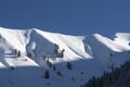 contours of mountain and snow cane after fresh snowfall on a sunny winter day