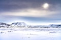 Contra jour snow covered mountain wilderness, north east Iceland in winter