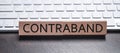 Contraband word on wooden block