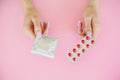 Contraception. Birth Control Pills and an unwrapped Condom. Colo Royalty Free Stock Photo