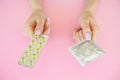 Contraception. Birth Control Pills and an unwrapped Condom. Colo Royalty Free Stock Photo