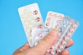Contraception methods concept / Woman holding contraception pills birth control contraceptive means prevent pregnancy