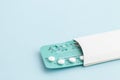 Contraception pills on blue background. Birth control Royalty Free Stock Photo