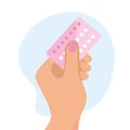 contraceptive pills in hand