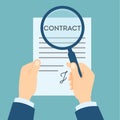 Contract analyzing with magnifyer. Royalty Free Stock Photo