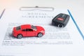 Contract document with car and remote key. buy and sale, insurance, rental and contract agreement concepts Royalty Free Stock Photo