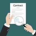 Contract inspection concept. Hands holding magnifying glass over a contract. Contract with signatures and stamp. Research Royalty Free Stock Photo