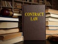 Contract law and pile of papers with gavel. Royalty Free Stock Photo