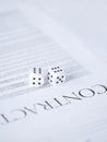 Contract paper with gambling dices Royalty Free Stock Photo