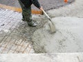 Contractor building new concrete pavement foundation in the garden. Foundation construction for paving, path Royalty Free Stock Photo