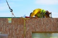 Contractor Building New Modular Frame Plywood Board Panel Walls House on the Building Site. Royalty Free Stock Photo