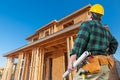 Contractor In Front New House Wood Framing at Construction Site Royalty Free Stock Photo