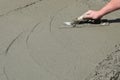 Contractor hand finishing concrete floor Royalty Free Stock Photo