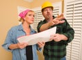 Contractor in Hard Hat Discussing Plans with Woman Royalty Free Stock Photo